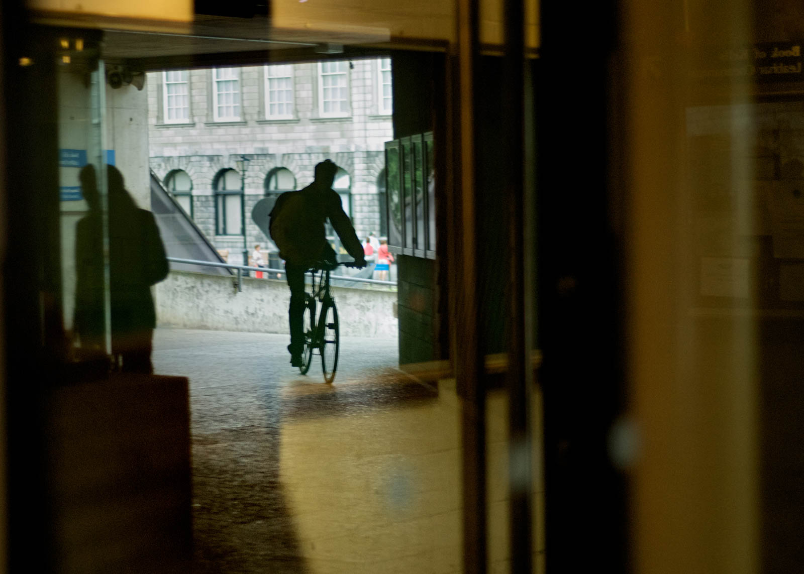 Dublin, Ireland, Reflections, Trinity College, bike, man on the bike, outthewindow